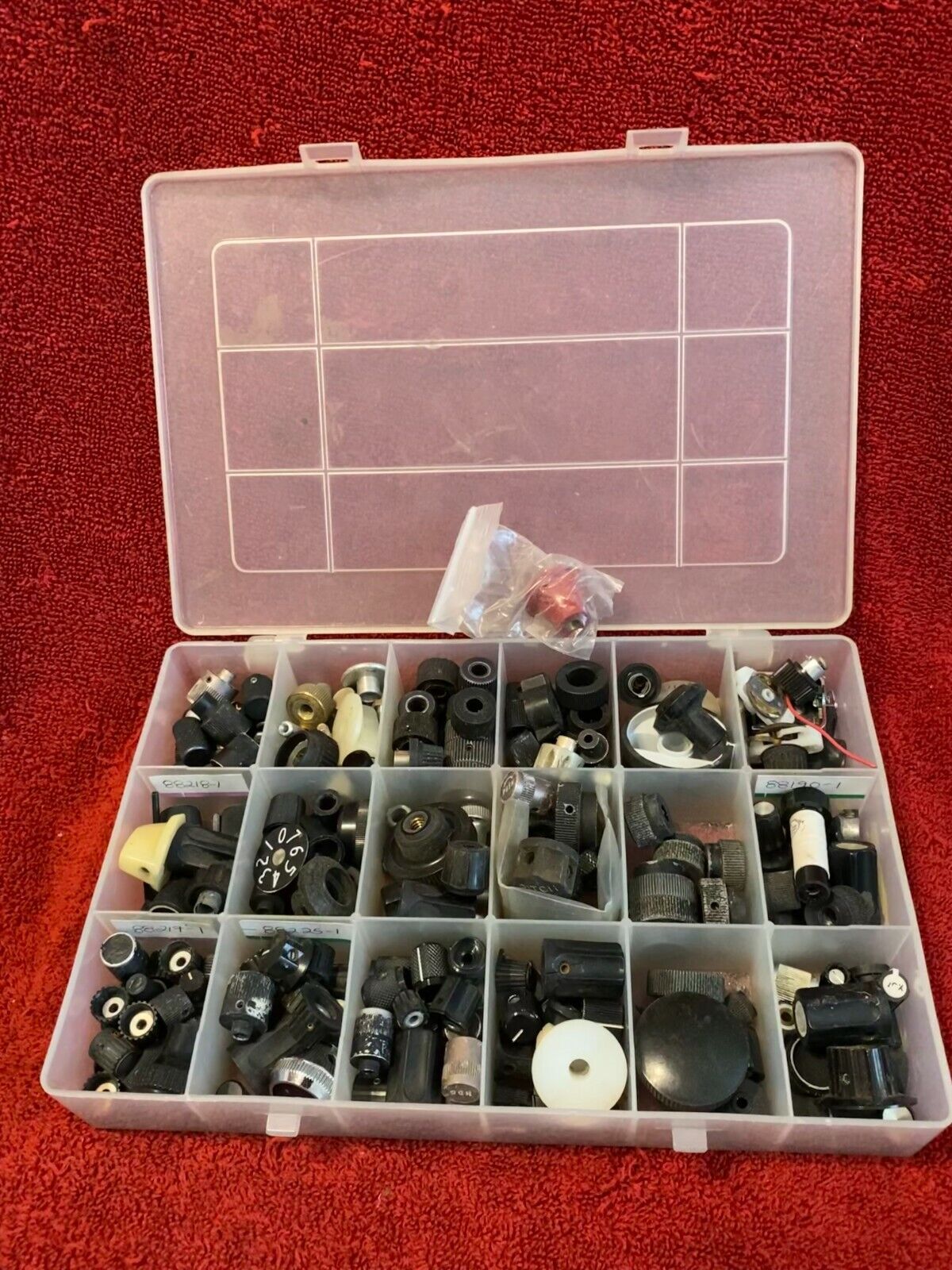 LOT OF AVIONICS KNOBS VARIED SIZES AND SHAPES IN ORGANIZER